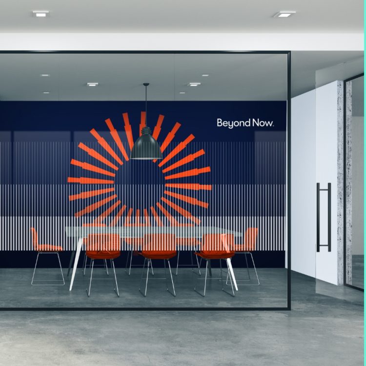 Beyond Now logo within an office