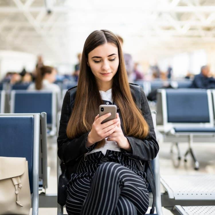BreatheSIM consumer on phone in airport